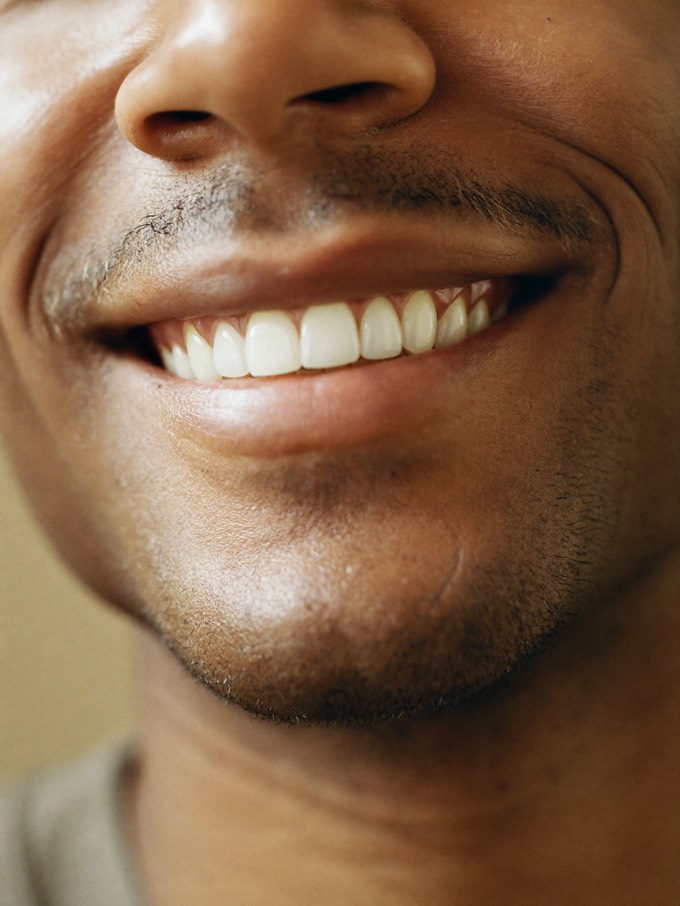Close-up of an easy, genuine smile with straight, bright, evenly aligned teeth